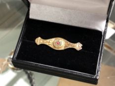 A Victorian 9ct gold ruby and pearl set brooch CONDITION REPORT: 1.