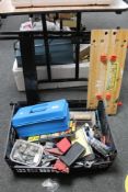 A folding workmate bench together with a crate of tools