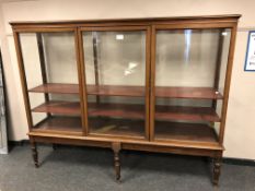 A Victorian mahogany glazed triple door cabinet, width 219 cm, height 172 cm, depth 52 cm.