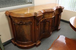 A Victorian mahogany serpentine fronted sideboard,