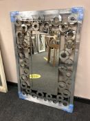 A contemporary all glass mirror 82 cm x 122 cm