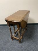An early twentieth century oak gateleg table