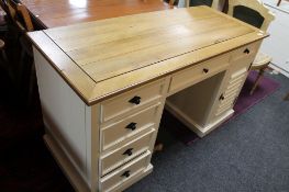 A reproduction painted white pedestal desk