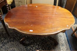 A Victorian mahogany shaped low table