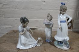Three Nao figures - child with puppy etc