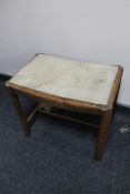 A reproduction telephone seat and small stool.
