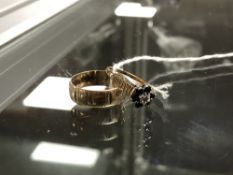 A 9ct gold band ring and a gold sapphire and diamond cluster ring, sizes L and J/K respectively.