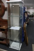 An Ikea all glass display cabinet