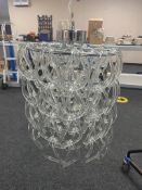 A contemporary glass ceiling light with glass drop shades