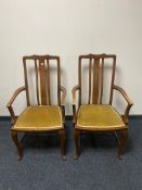 A pair of mahogany armchairs