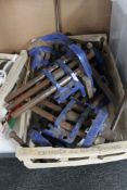 A crate of metal bench vice