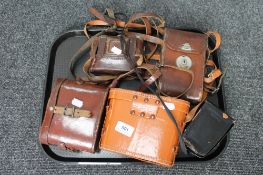 A tray of two pairs of binoculars,