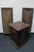 A pair of painted wooden panels together with an Edwardian pot cupboard