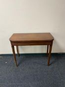 A nineteenth century mahogany tea table