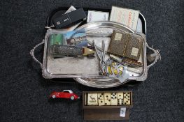 A tray of dominoes, nut cracker, matchbox car,