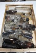 A tray of antique and later glass bottles