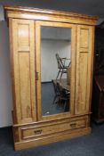An Edwardian burr walnut mirrored wardrobe