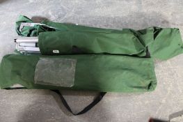 Two folding camping beds and box of oil filters