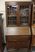 An Edwardian oak bureau bookcase