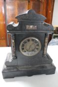 A Victorian marble and black slate mantel clock