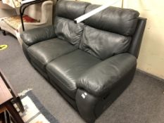 A blue/green leather two seater reclining settee