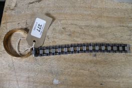 A Louis Vuitton bangle together with a further chain bracelet