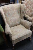 A reproduction Queen Anne style armchair in floral covering