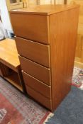 A teak five drawer chest CONDITION REPORT: 113cm high by 41cm wide by 47cm deep.