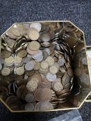 A tin of coins, copper,