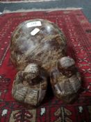 An African carved hardwood ornament of two figures