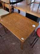 An extending teak low table.