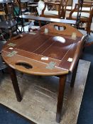 A reproduction mahogany butler's tray on stand