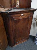 A nineteenth century oak corner cabinet