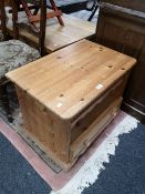 A pine entertainment stand fitted with a drawer