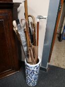 A blue and white stick pot, sticks,