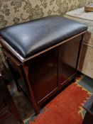 An antique storage stool