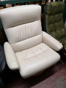 A cream leather relaxer chair.
