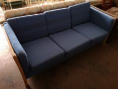 A beech framed three seater settee.