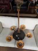 A mid century ceiling light with five way glass shade.