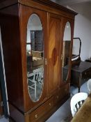 A three piece inlaid mahogany Edwardian bedroom suite