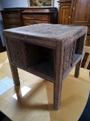 A carved pine book table