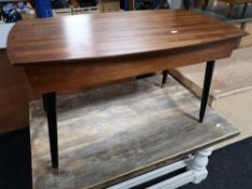 A teak storage table