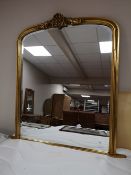 A Victorian style bevelled overmantel mirror CONDITION REPORT: 126cm wide by 132cm