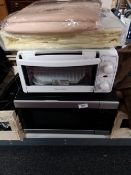 A microwave oven and cookworks table oven