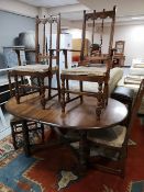 An Ercol extending table and four chairs