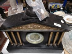 A Victorian slate gilt highlighted mantel clock with pendulum and key