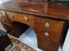 An early nineteenth century mahogany pedestal sideboard