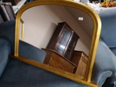 A gilt framed overmantel mirror