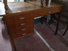 A teak mid century office desk.