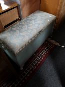 An early twentieth century wicker storage basket with two pine crackets